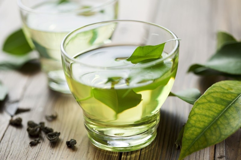 uống trà giảm mỡ máu